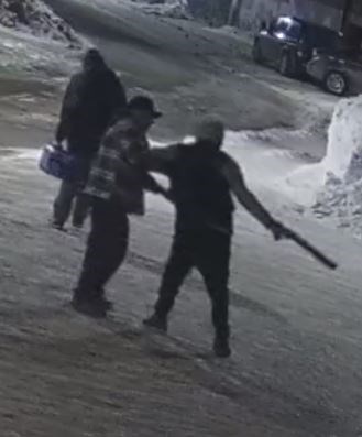 Surveillance video images show suspects, one armed with a sawed-off shotgun, who robbed a 43-year-old man in a parking lot on Thompson’s Public Road on March 26.