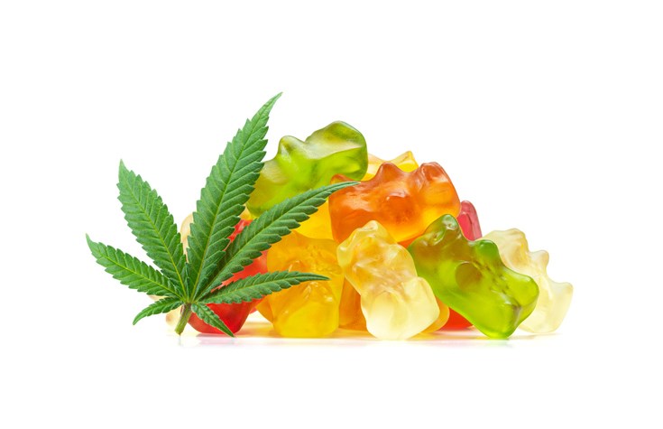 cannabis-leaf-and-gummies-by-viennetta-getty-images