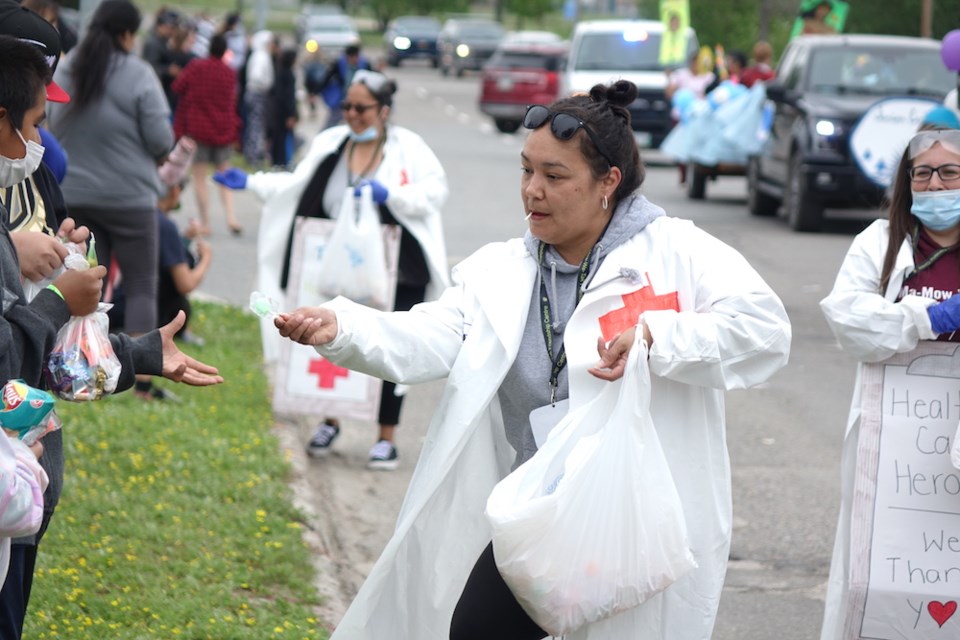 The Lions Club parade with a theme of health care heroes drew a healthy number of spectators seeking to collect some of the less-than-healthy candy that parade participants were handing on out on the morning of June 25.                               