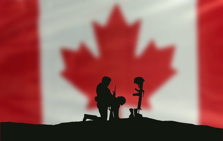 remembrance day kneeling soldier canadian flag