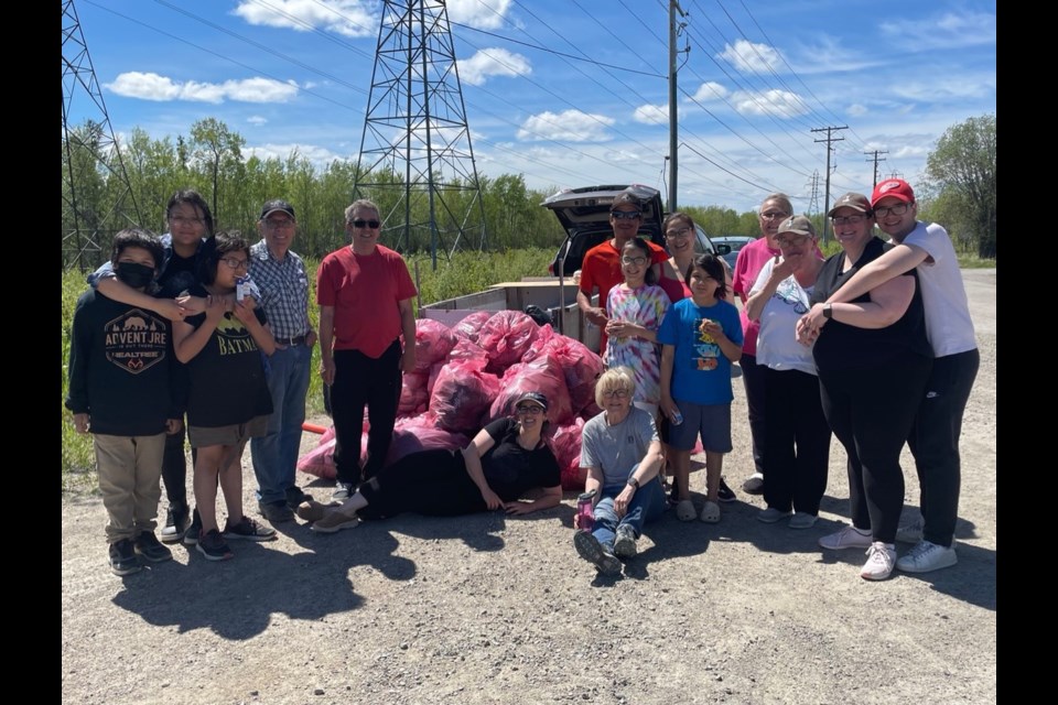 Residents and property owners on a section of Brandon Crescent in Thompson with all the garbage they picked up during a neighbourhood cleanup June 11.