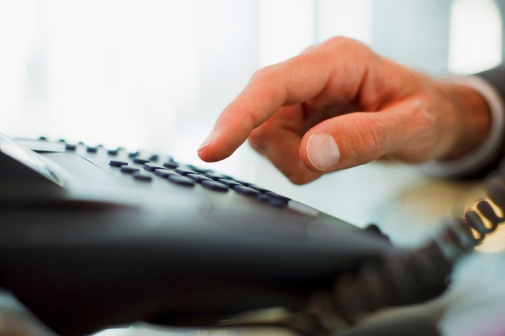 hand dialling landline telephone Paul Bradbury Getty Images