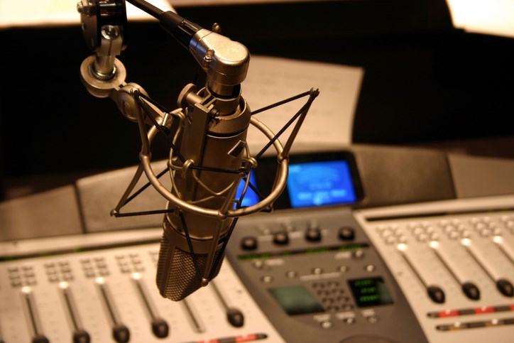 radio station microphone in front of mixing board photograph by Gesundheit getty images