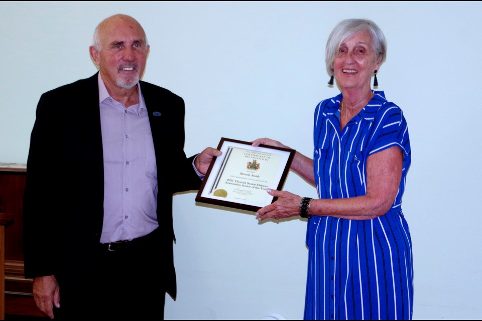 Regional Councillor Tim Whalen presents Beverly Smith with the 2021 Senior Citizen of the Year award, from the Thorold Senior Citizens Association.