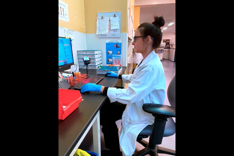 Candace Dickson working at her job in the lab. Submitted photo