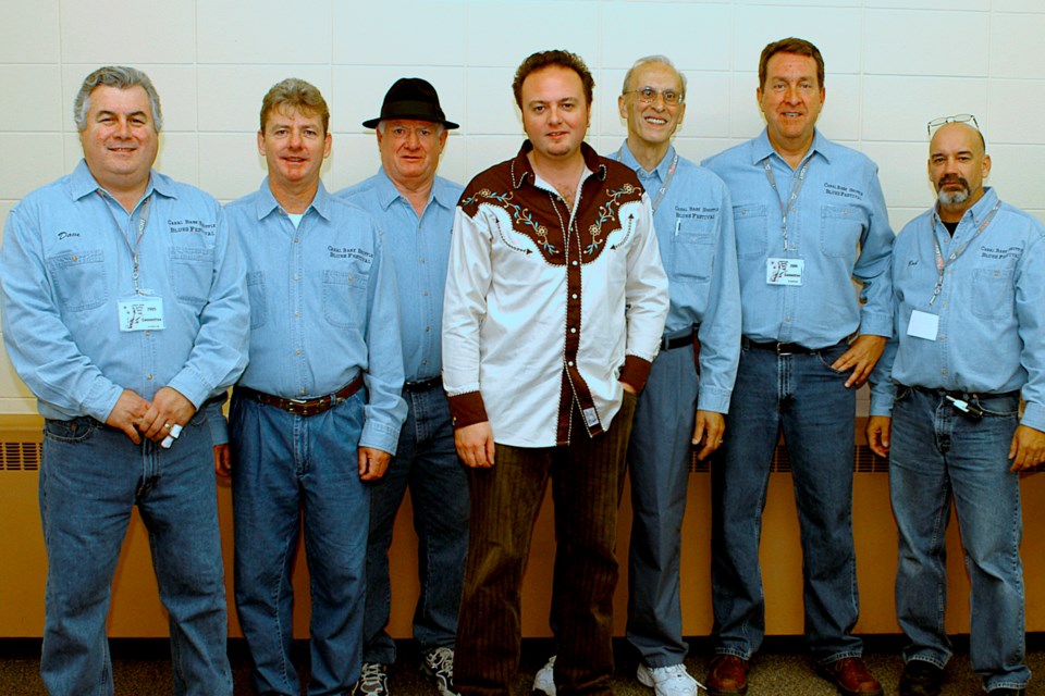 Canadian blues artist David Gogo (c) is flanked by original Shuffle committee members (l-r) Dave Rotz, John O’Brien, Tim Sinnett, Rudy Walters, John Davis and Bob Liddycoat. Submitted Photo