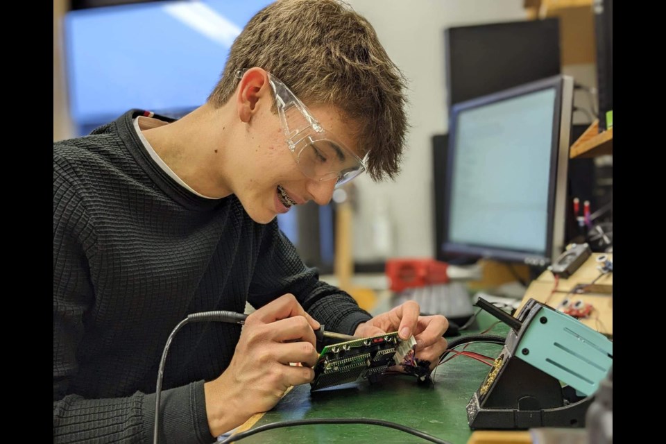 Elijah Cosby working on his wearable visual assistance device.