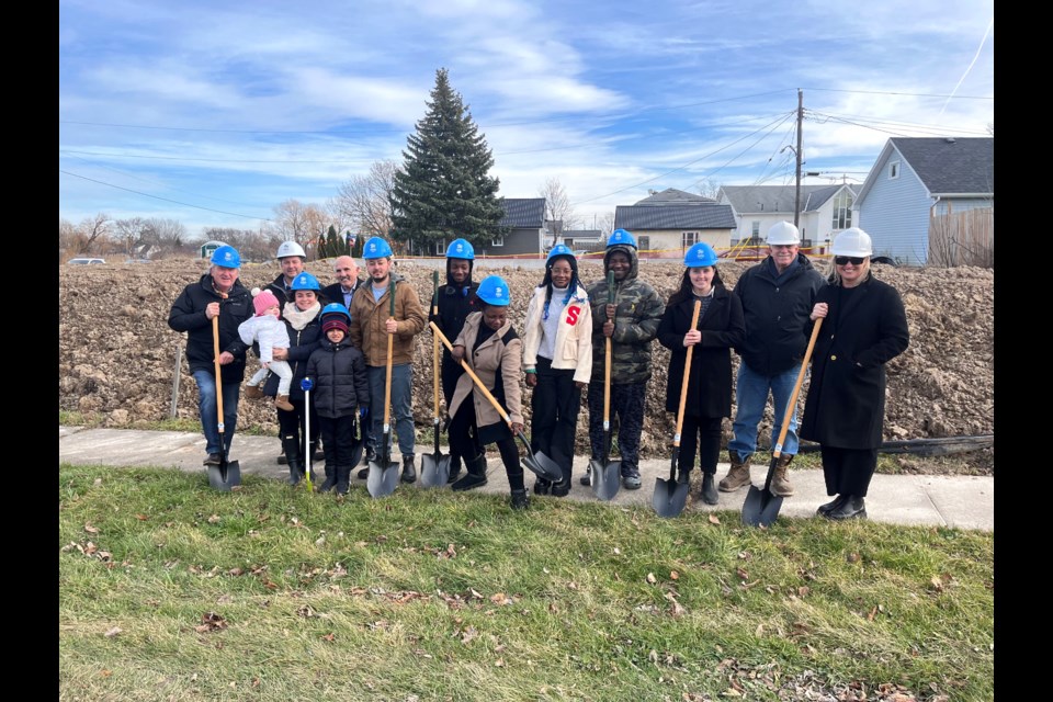 Mayor Terry Ugulini, Habitat Niagara CEO Mark Carl, Regional Councillor Tim Whalen, two families who will take up residence in the homes once complete, a representative of MP Vance Badawey's office, Richard TenDen of Cairnwood Homes.