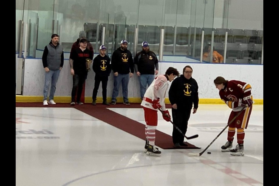 Thorold Anchors president Carmine Ciolfi drops the puck at the Thorold Blackhawks game against the Caledonia Corvairs on Friday night.