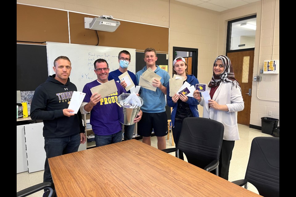 l-r: Coach Duane Kemp; teacher Cam Stone; Students Kyle Davidson, Ethan Belward, and Will Sargeant; the chair of the Parents Council Maimoona Munam.