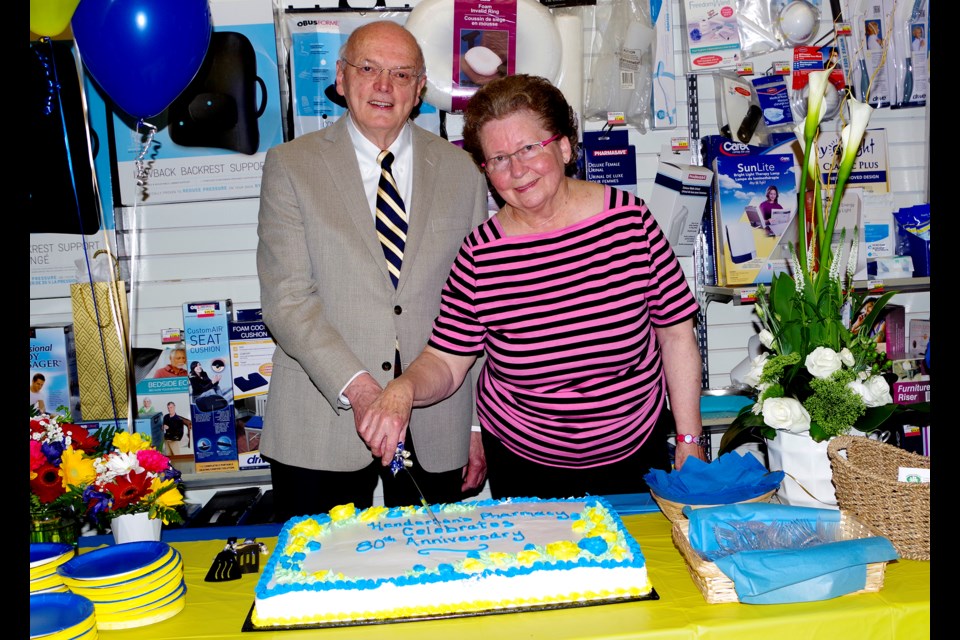 John and Cathy Henderson marked the 80th Anniversary of Henderson's Pharmacy Friday morning after a month-long celebration at the Front St. business. Bob Liddycoat / Thorold News