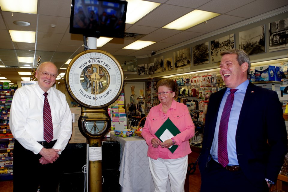 Owners John and Cathy Henderson share memories surrounding the famed weigh scale with MP Vance Badawey. 