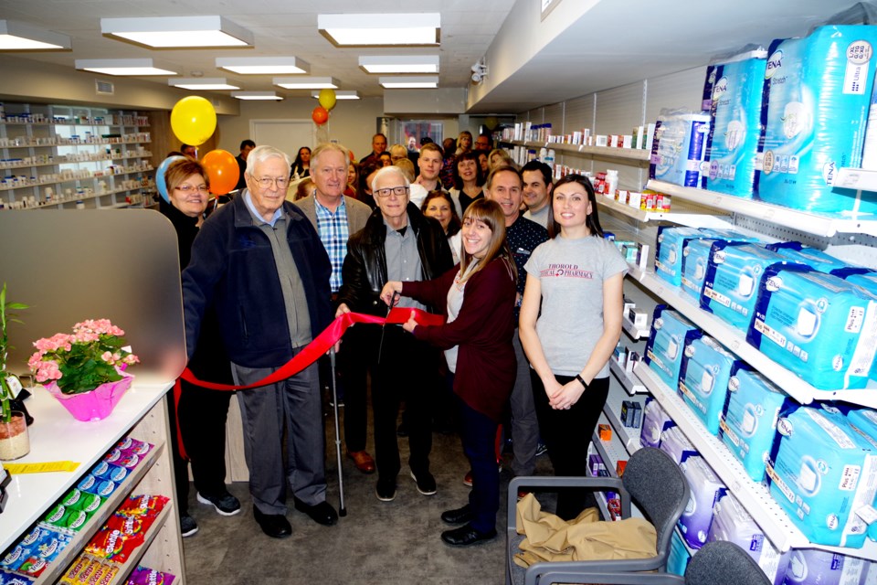 Joining friends and family and helping to cut the ribbon at the Thorold Medical Pharmacy were (l-r) Councillor Nella Dekker, Dr. Don McMillan,  Mayor Terry Ugulini, Dr. Pringle, Dr. Tatzel, with owners Christina Ciancio and Alexandra Tatzel (r). Bob Liddycoat /Thorold News
