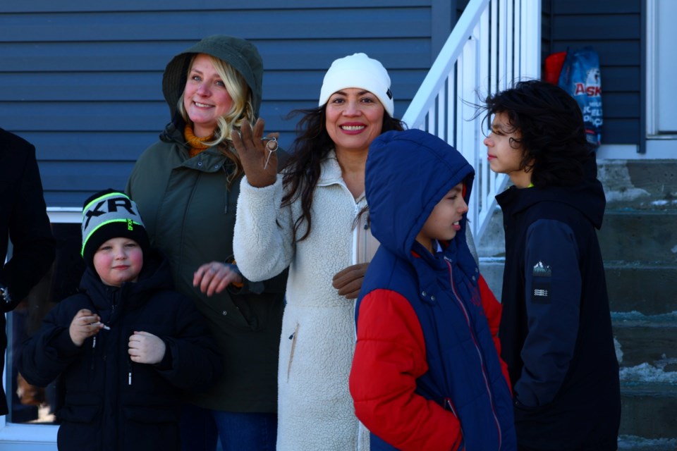 Four families received keys to their new homes thanks to Centennial Homes through Habitat for Humanity.