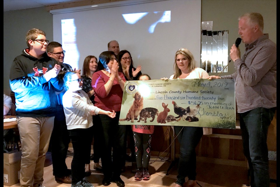 In honour of the late John LePera, friends and family held a Trivia fundraiser for the Humane Society last Saturday at Club Belvedere, and presented the organization with a cheque for $5,625. Submitted Photo