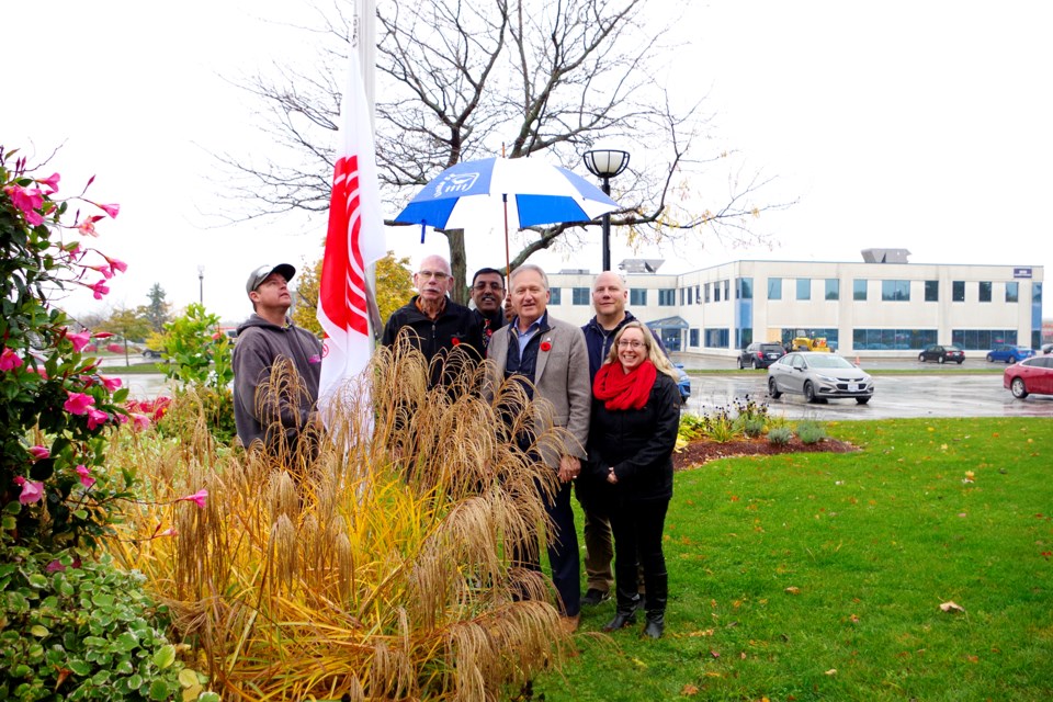City employee Scott Walton raises the flag on behalf of City Hall launching the United Way Mayor's Challenge. Taking part were (l-r) councillor Fred Neale, CAO Manoj Dilwaria, Mayor Terry Ugulini, councillor Ken Sentance, and Tanya Faulkner, Labour Program & Services Coordinator for the United Way. Bob Liddycoat / Thorold News