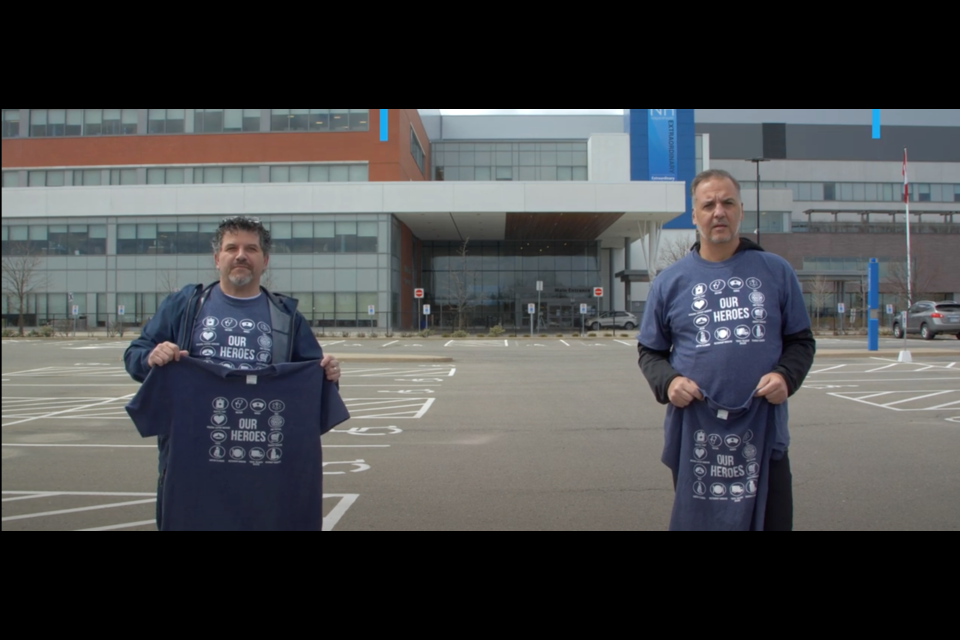 Santino Perri, left, and Joe Mannella, right, holding up the limited edition t-shirts printed to support health-care workers in the region. Photo: Supplied
