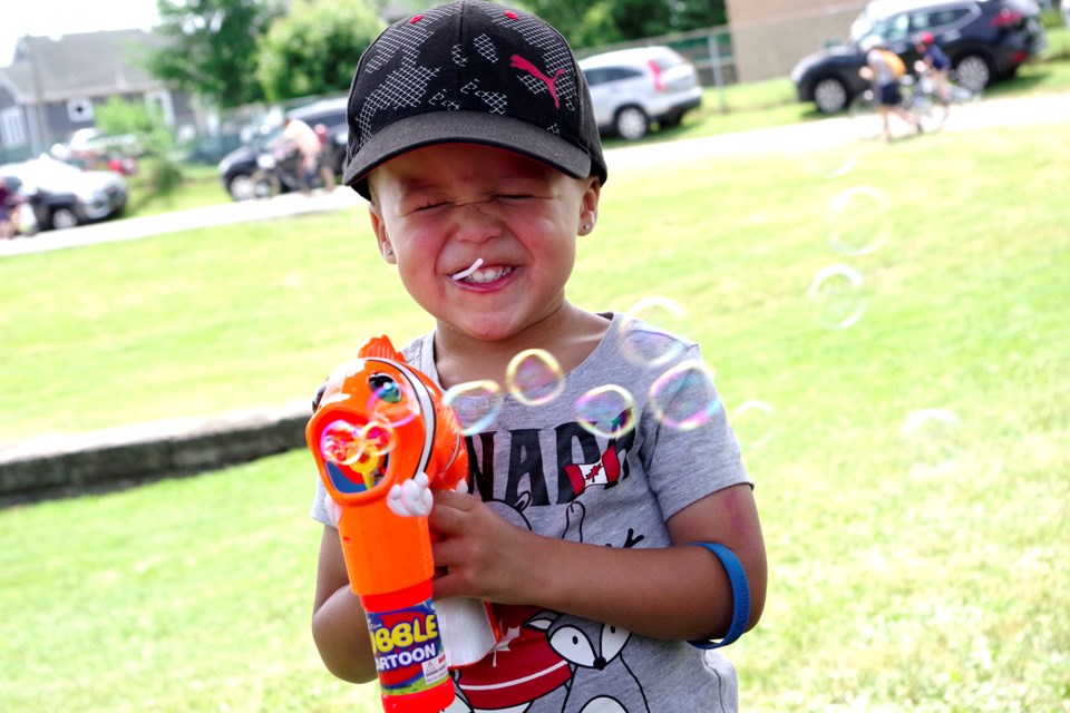Two-year-old Khyree Cadogan created his own Canada Day celebration with  his bubble machine. Bob Liddycoat / Thorold News