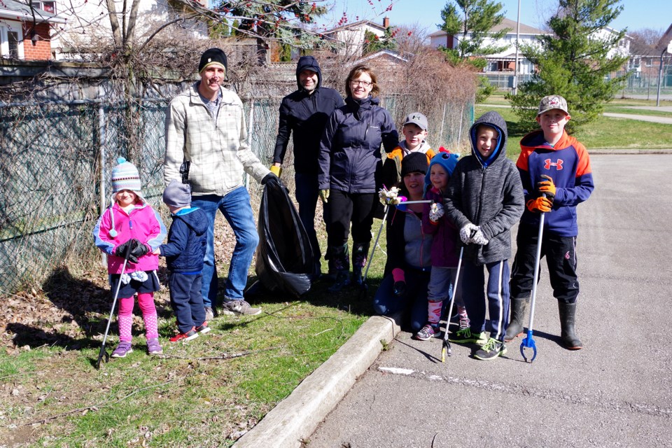 The Schilstra and Kaiser families look after cleaning up Confederation Park. Bob Liddycoat / Thorold News