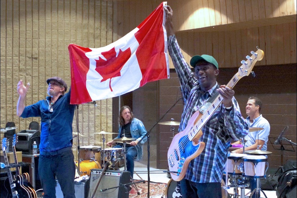 JP Soars (l) and bassist Cleveland Frederick raised the Canadian Flag, happy to perform in Thorold, Ontario Canada, last night. Bob Liddycoat / Thorold News