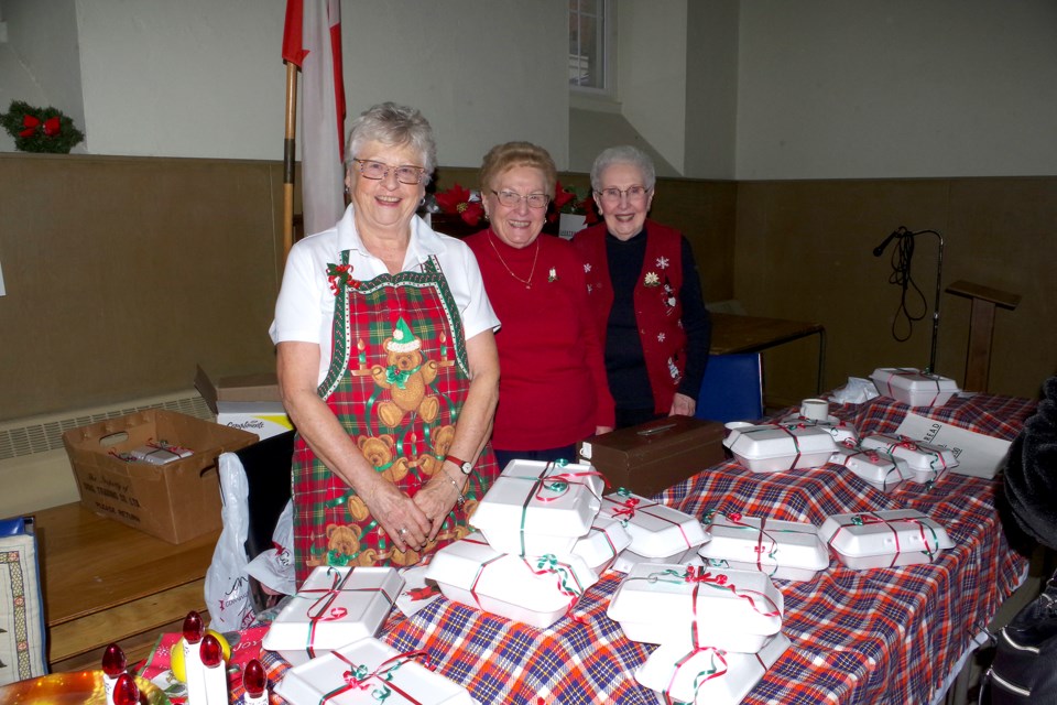 Marg Neudorf, Nancy Holland and Doreen Taylor pitched in to raise funds at St. Andrew's Christmas bazaar Saturday. Bob Liddycoat / Thorold News