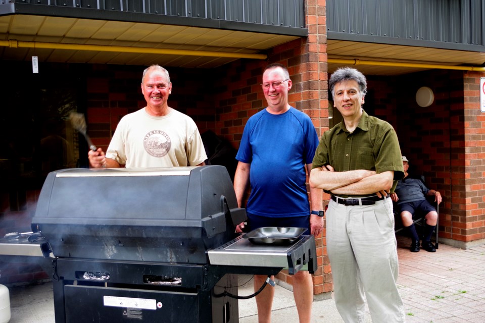 Taking turns at the grill were (l-r) George Ravenek, Kevin Cowling and Sergio Paone. Bob Liddycoat / Thorold News