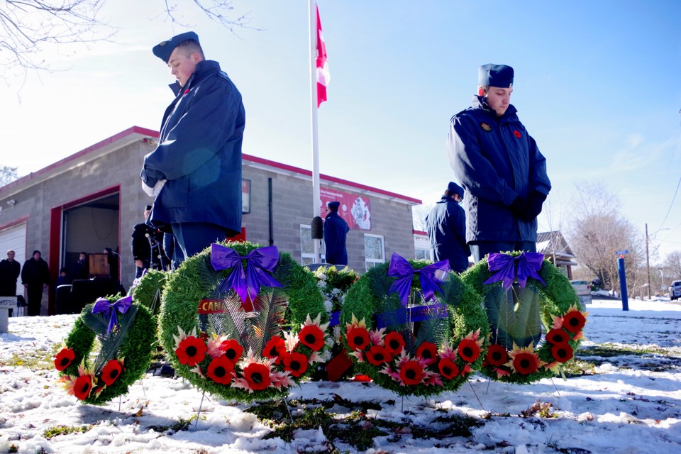 Flag at half-staff, members of the 128 Royal Canadian Air Cadet Squadron, stand guard at the War Memorial in Port Robinson during Remembrance ceremonies yesterday. Bob Liddycoat / Thorold News