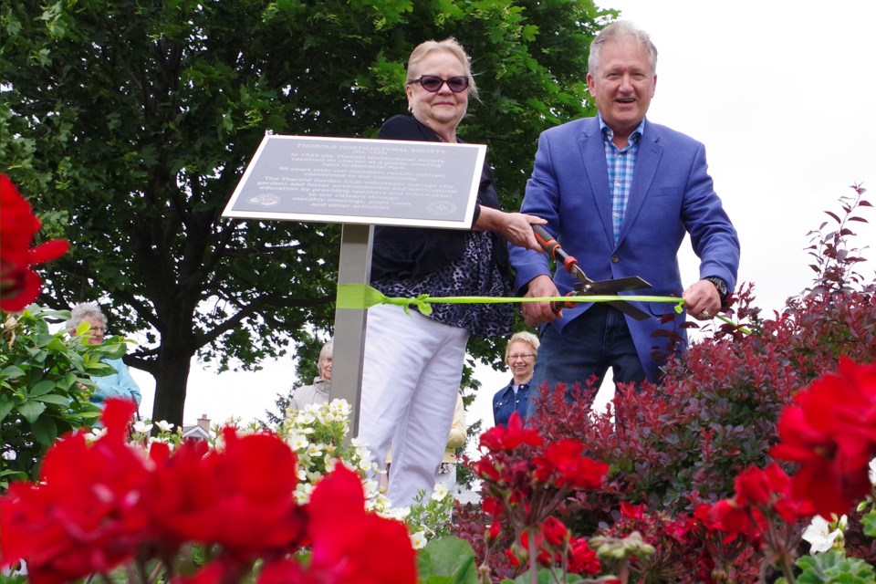 Thorold Garden Club president Leslie Daniels and Mayor Terry Ugulini cut the ribbon at the revamped Richmond Street Parkette dedication. Bob Liddycoat / Thorold News