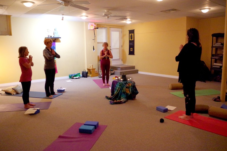 Yoga instructor Cheryl Gordon led a Solstice celebration at the Yoga Centre of Niagara Thursday, which included a cleansing burning ceremony. Bob Liddycoat / Thorold News