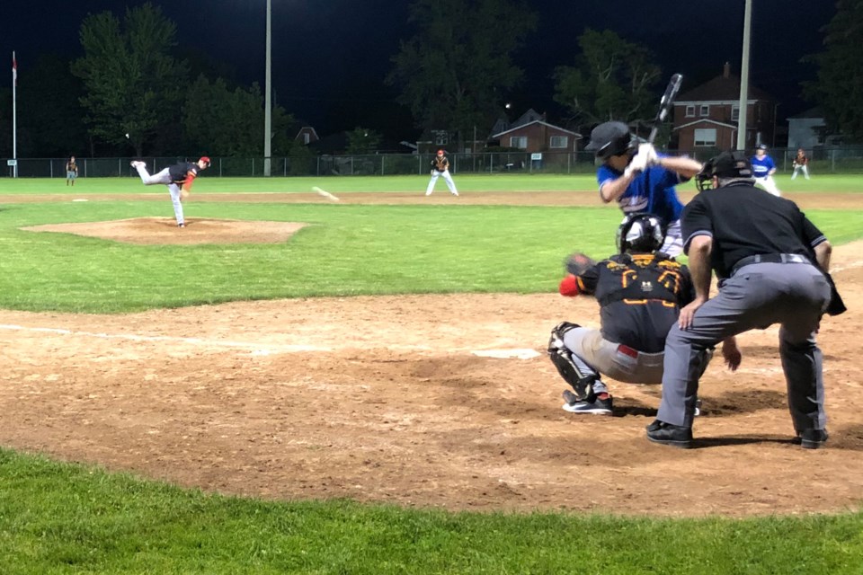  Reliever Jared McInnis earned a save last night. Here, he delivers to Malcolm Lepp of the Cobras. Alex Rotundo / Thorold News