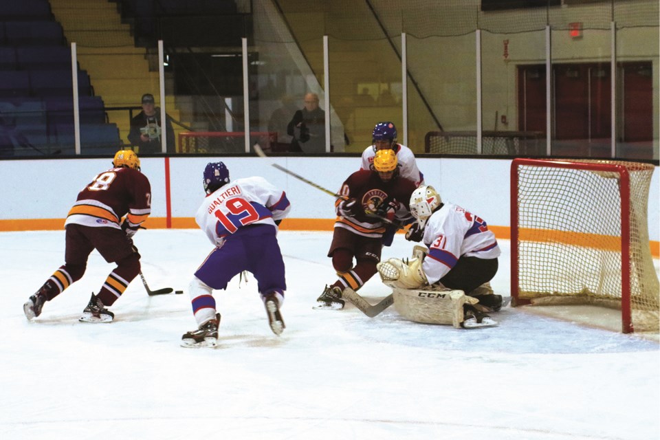 The new maroon and gold uniforms didn't help Thorold last night. Here, Brad Ditillio (28) was stopped on a first-period scoring chance. Bob Liddycoat / Thorold News