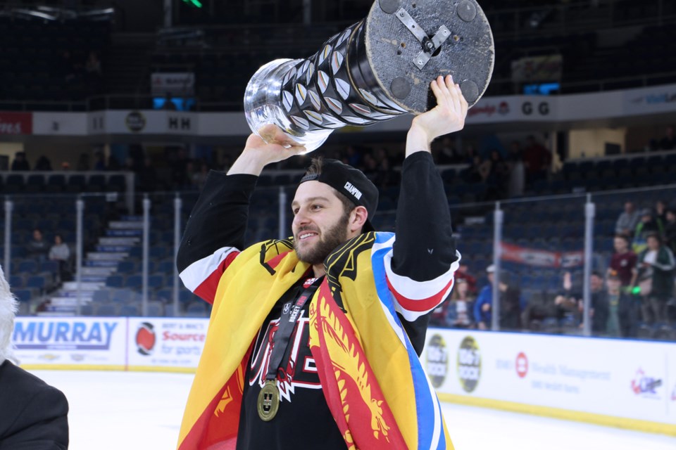 Thorold native Randy Gazzola hoists the David Johnston University Cup after his UNB Reds captured the national university hockey title. Submitted Photo