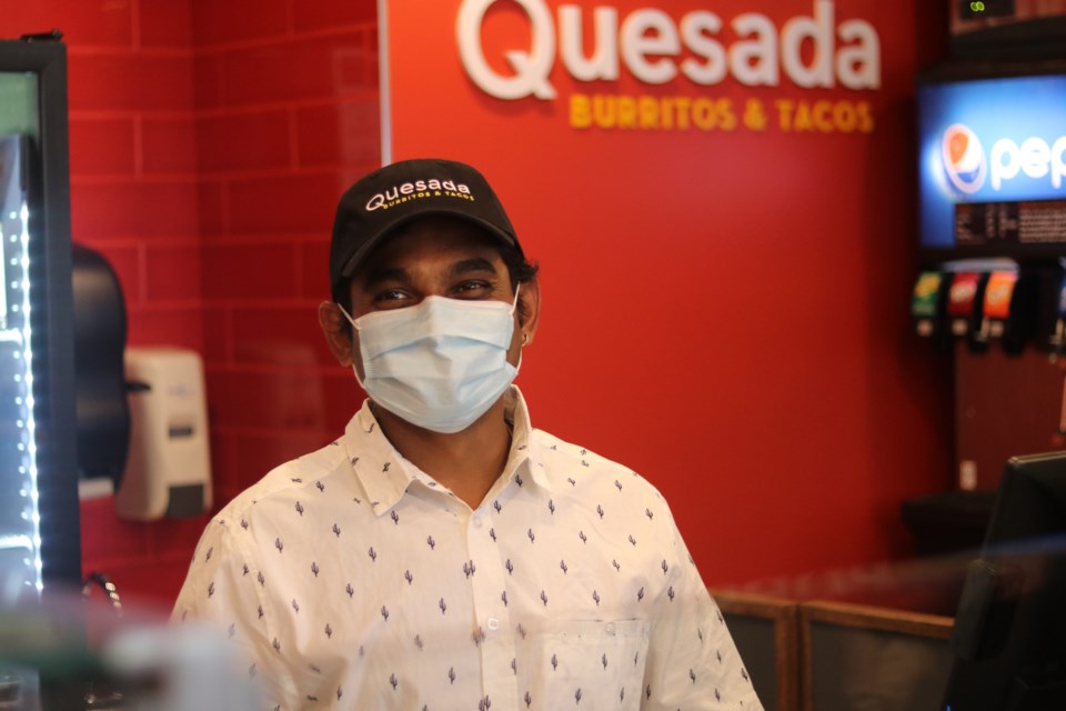 The owner of Quesada Burritos and Tacos Dixitkumar Patel at the grand opening Wednesday.