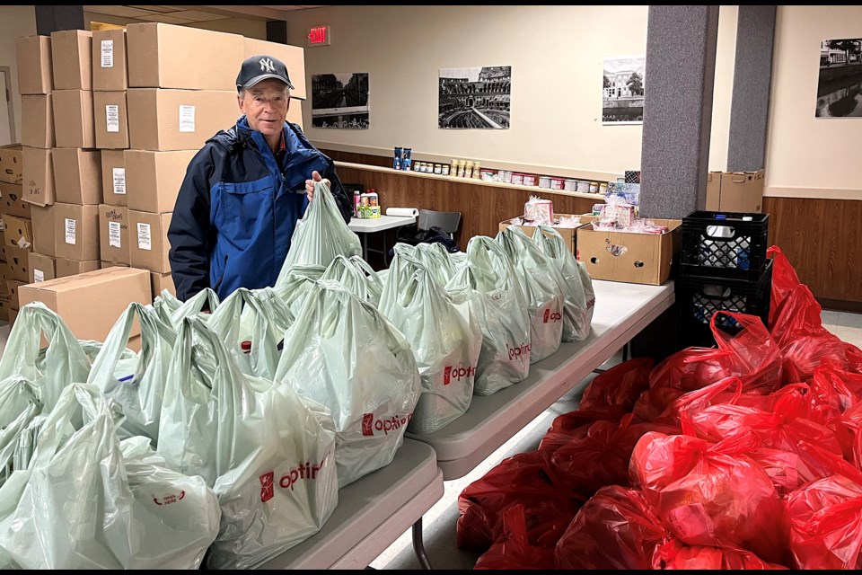 Timmins Food Bank Chairman Rick Young shows some ready filled bags to be given to families and individuals.