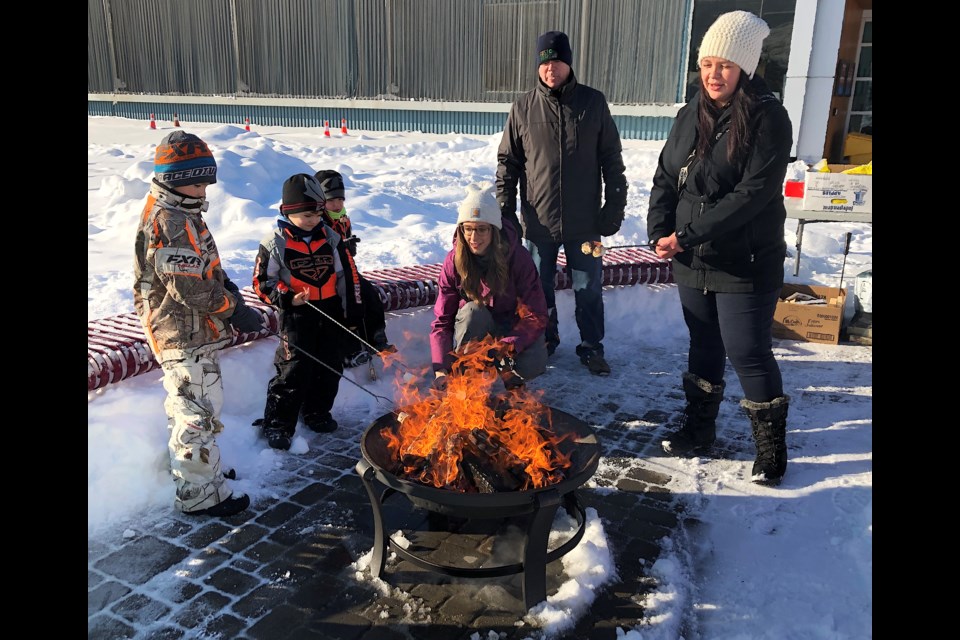 Roasting marshmallows is always a welcome winter activity. A bonfire made it possible outside the Timmins Museum: National Exhibition Centre during Holiday Fun Day in Downtown Timmins. Wayne Snider for Timmins Today