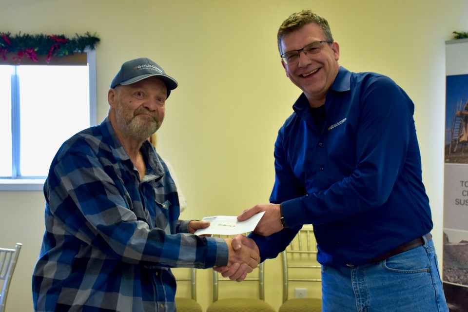 The Good Samaritan's Ed Ligocki accepts $10,000 from Goldcorp general manager Marc Lauzier. Maija Hoggett/TimminsToday