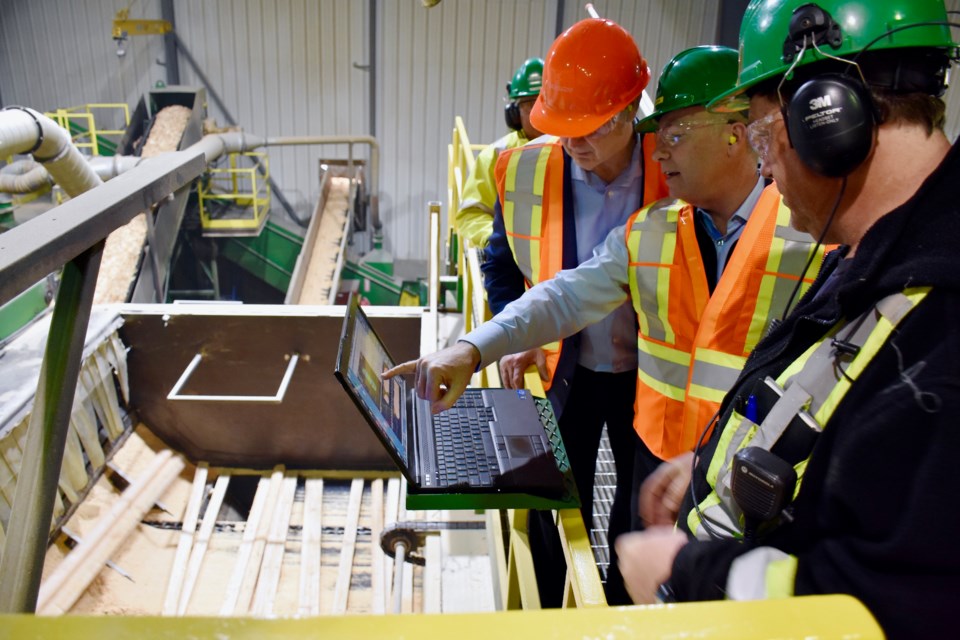 EACOM president and CEO Kevin Edgson shows Ontario Minister of Natural Resources and Forestry John Yakabuski the Timmins sawmill. (Maija Hoggett/TimminsToday)