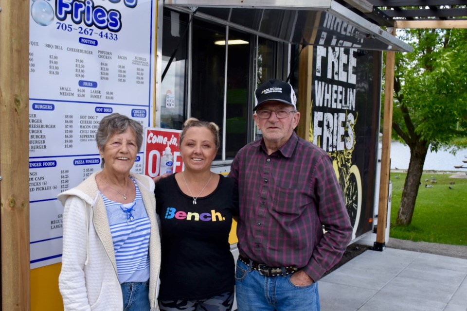 Fabi Allaire, left, Linda Walton, and James Allaire are ready to raise cash for Living Space at Bubbles Fries down at Gillies Lake. All the money made Thursday, June 27 at the chip stand in the parking lot is for the downtown facility. Maija Hoggett/TimminsToday
