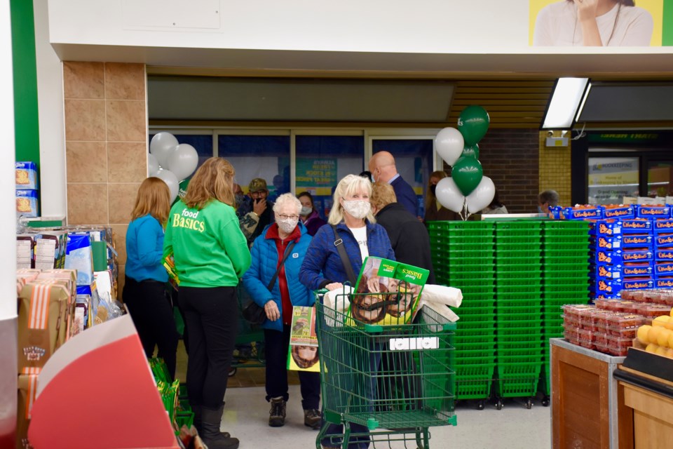 The first customers through the doors of the new Food Basics at the Porcupine Mall.