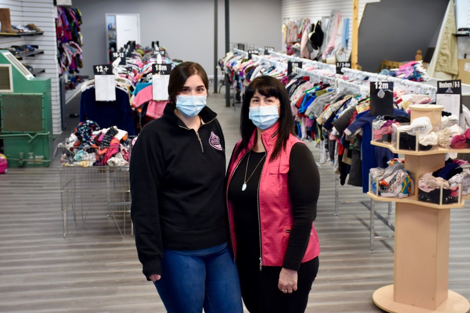 Sydney McIntyre, left, and Carole Young are the mother-daughter team behind Second Time Around. The new downtown Timmins business is a children's thrift store.