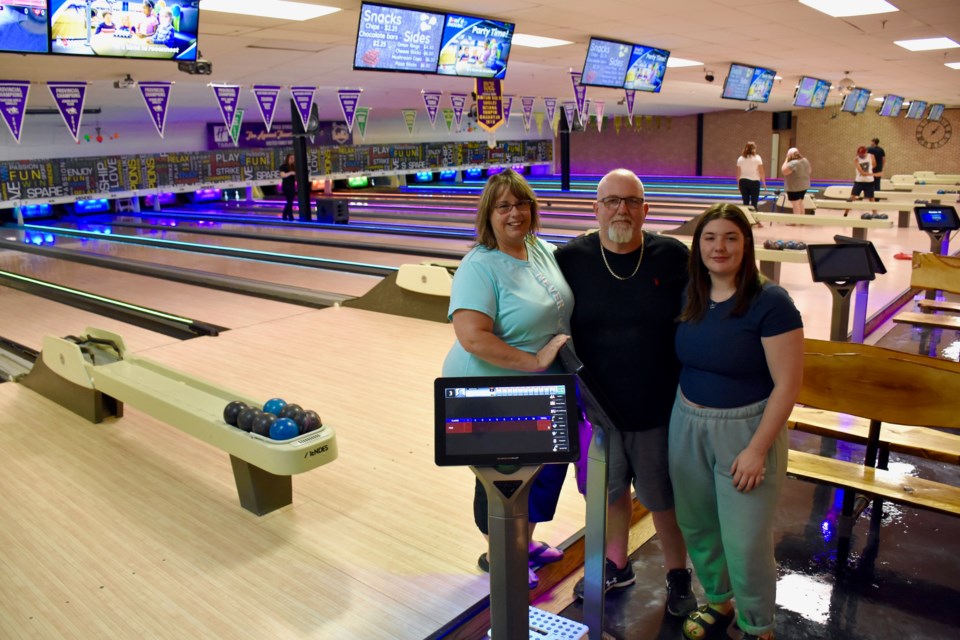 Mid-Town Bowl owners Nat and Clint Berry with their daughter Vanessa. The Timmins bowling alley has reopened after being closed for seven weeks to install a new interactive computer systems, lighting and lane improvements, as well as updating some of the floors and bathrooms.