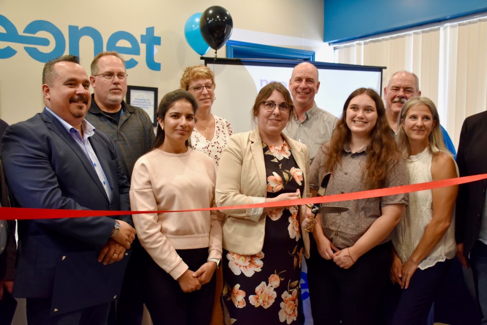 NEOnet staff, board members and other dignitaries at the reopening of NEOnet in a new downtown Timmins location.