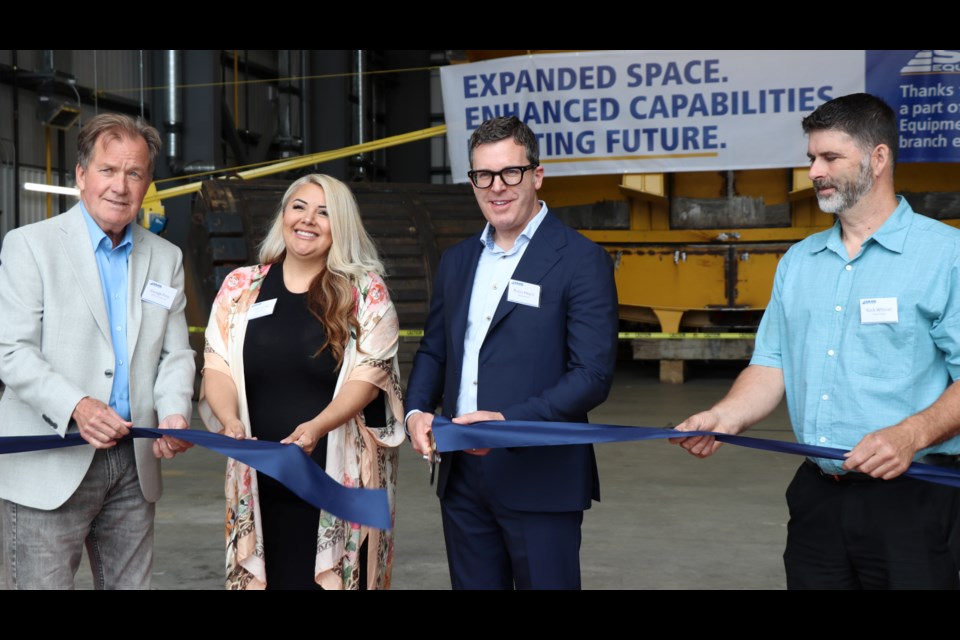 Timmins MPP and Mines Minister George Pirie, Mattagami First Nation Chief Jennifer Constant, SMS Equipment president and CEO Robin Heard, and Timmins city Coun. Rock Whissell cut the ribbon at the new SMS Equipment Facility.
