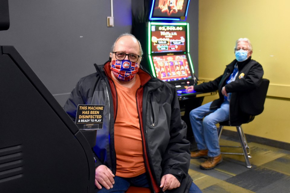 TapTix games at Jackpot City Gaming Entertainment are cleaned after every use. Pictured is Timmins Charitable Gaming Association vice-president Ron Lafreniere, left, and president Ray Rivest. Maija Hoggett/TimminsToday