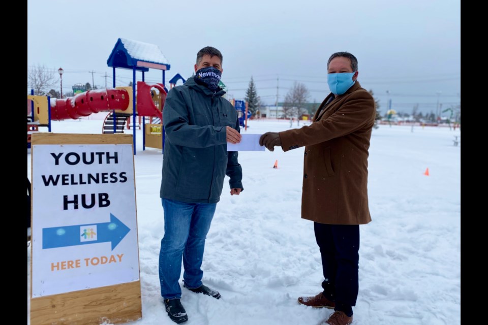 Newmont Porcupine's Bryan Neeley, left, and Cochrane District Social Services Administration Board CAO Brian Marks. Newmont Porcupine recently donated $50,000 to the Youth Wellness Hub in Timmins. Supplied photo