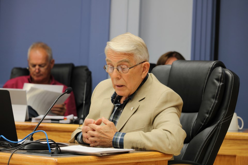 Councillor Pat Bamford checks his numbers as he disagrees with calling a request for an additional $570,000 as being 'over budget'. Andrew Autio for TimminsToday