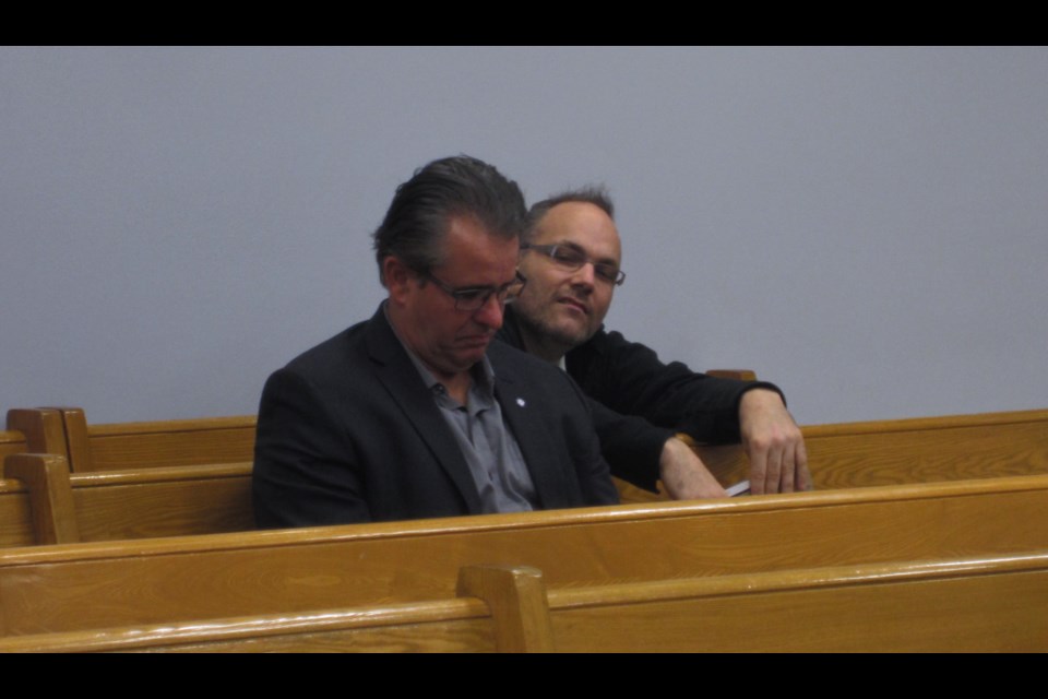 Councillor Rick Dubeau (left) sits in the audience after officially 'leaving' the meeting. Former city councillor and mayoral candidate Todd Lever (right) watched the meeting, made his presence felt, and was told to keep quiet by Mayor Steve Black. Andrew Autio for TimminsToday                           
