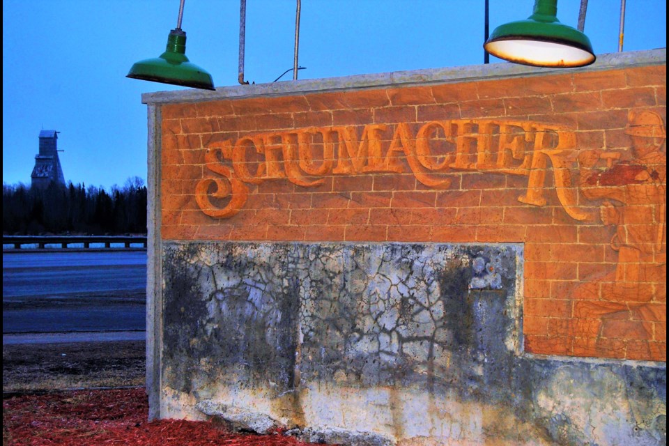 The Schumacher Sign at the junction of Highway 101 and Father Costello Drive, with the McIntyre headframe in the background, Frank Giorno for TimminsToday.