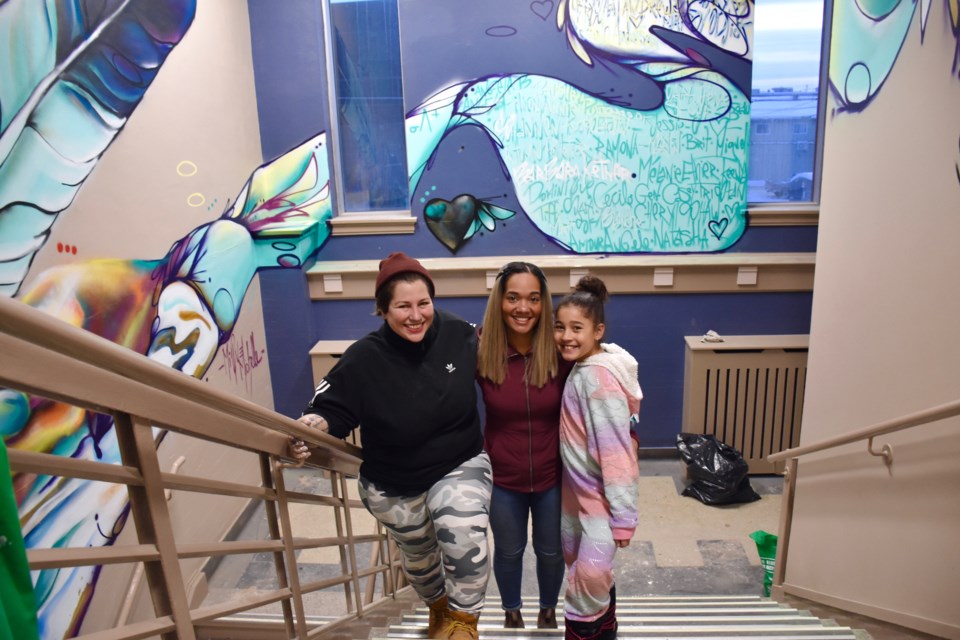 Artist Mique Michelle after finishing a mural in the staircase at Timmins City Hall, along with Coun. Kristin Murray, who spearheaded the youth mural project in the city. Maija Hoggett/TimminsToday