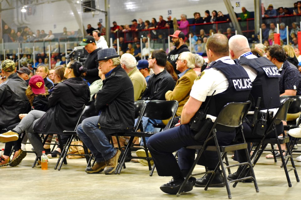 Timmins Police Chief Dan Foy and Deputy Chief Henry Dacosta listen to the comments at the public meeting.